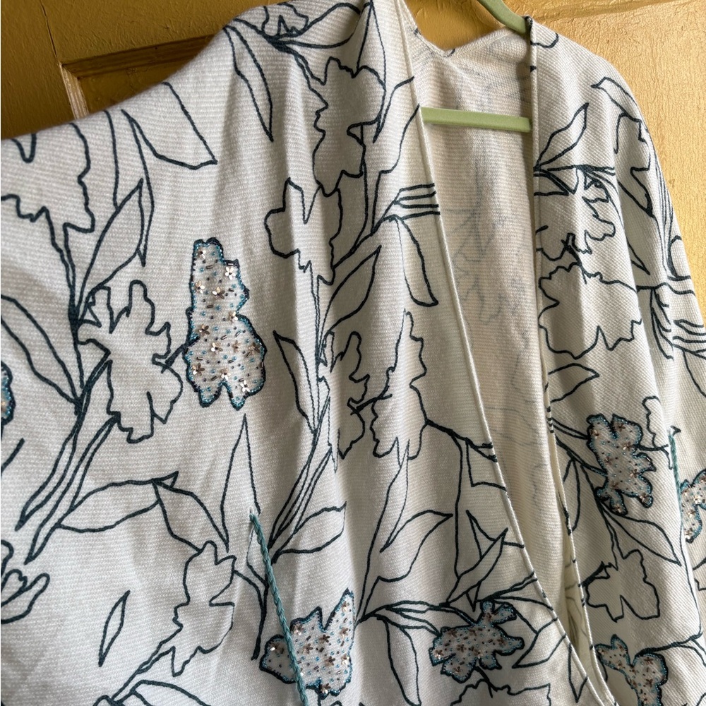 Open front sweater with beading